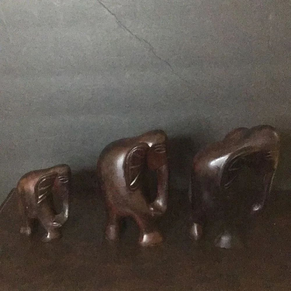 Family Of wooden carved elephants Appear to be mahogany